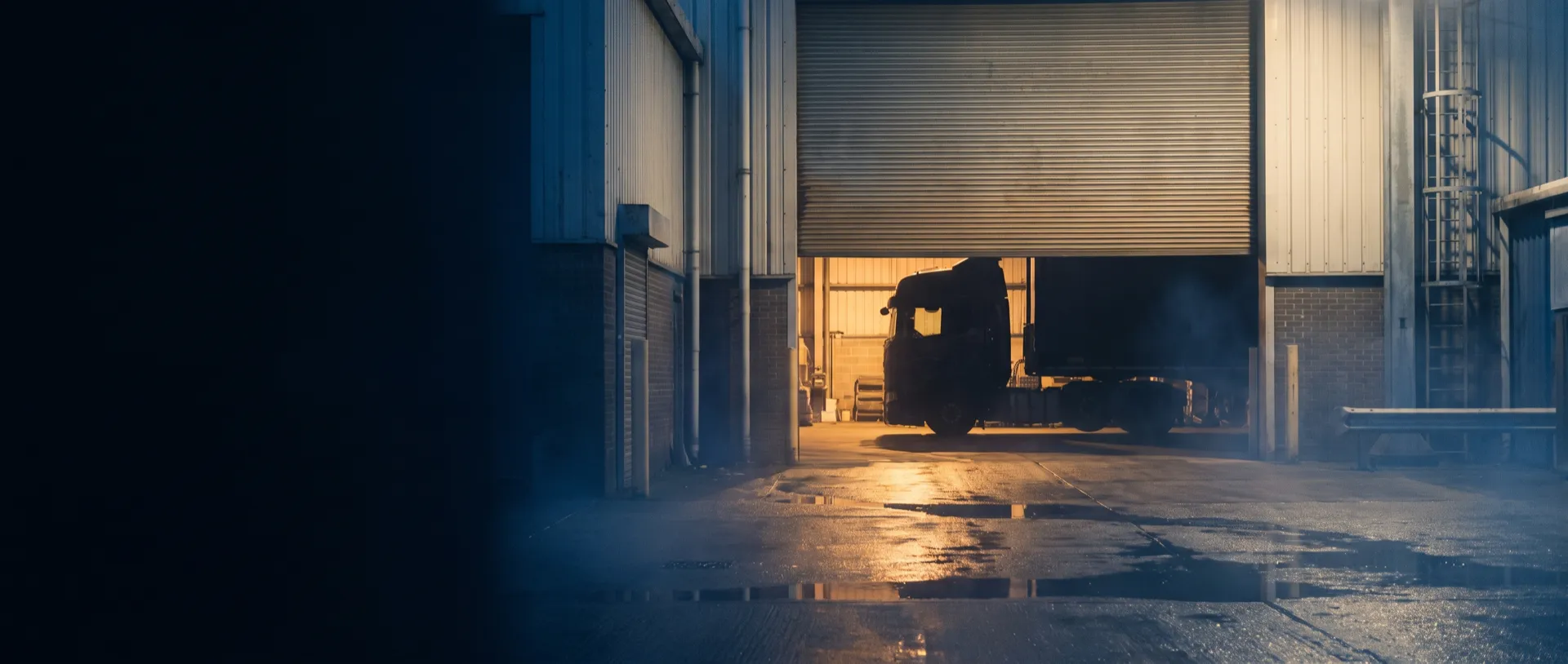 Haulage & Transport — warm light through an open door